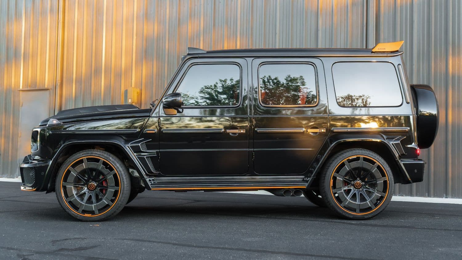 Corrected deep black paint on a Brabus G-Wagon side profile
