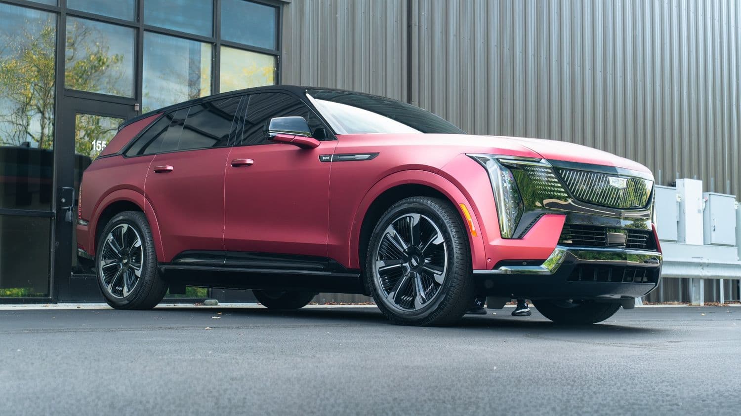 Matte red full color-change wrap on a Cadillac Escalade IQ
