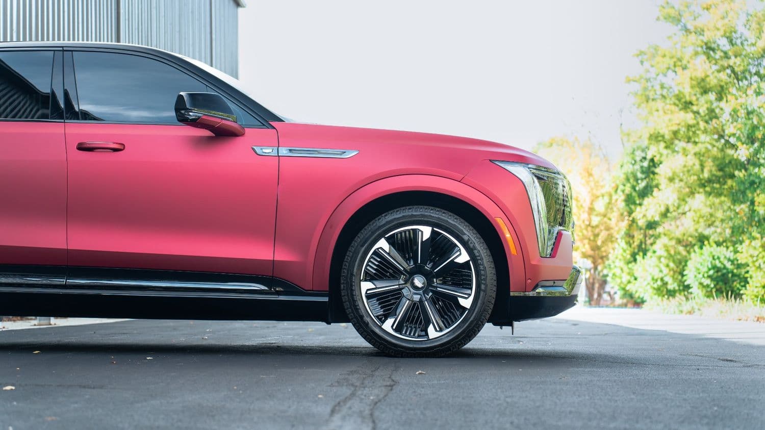 Satin red wrapped Cadillac Escalade IQ side profile