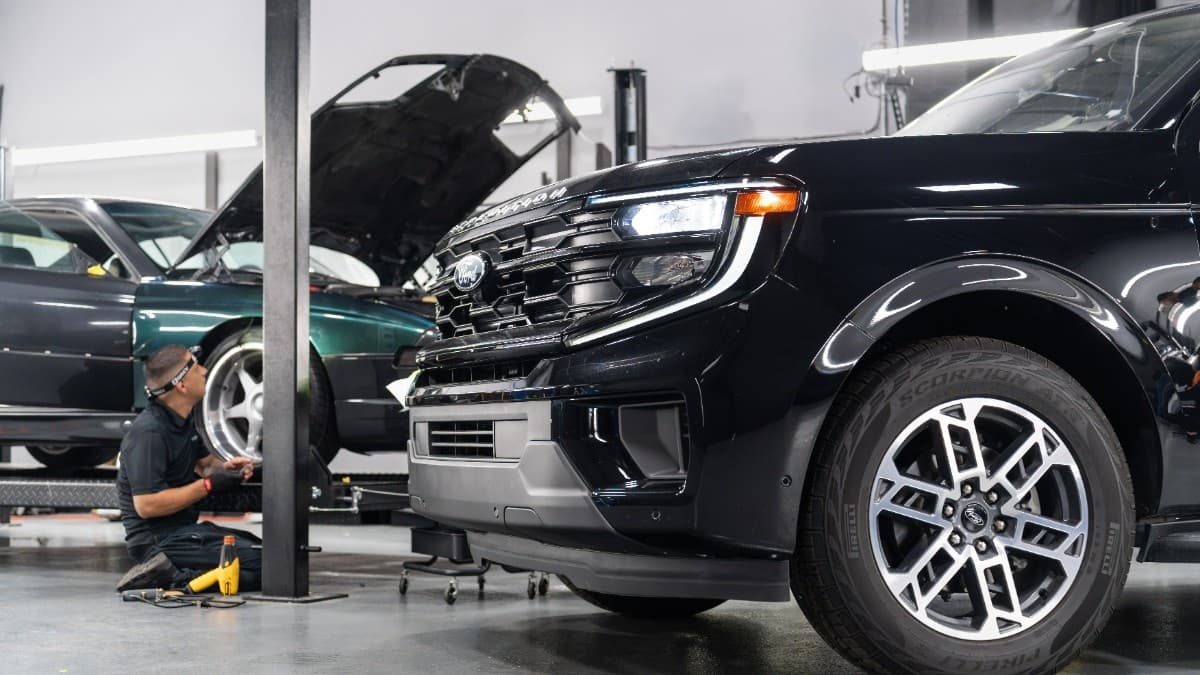 Be Tinted technician preparing a vehicle in the studio